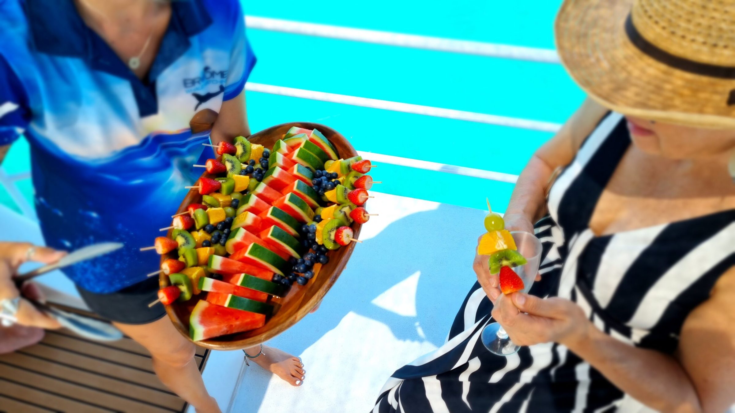 a person sitting at a table with a cake
