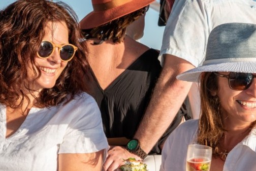 a person wearing a hat and sunglasses