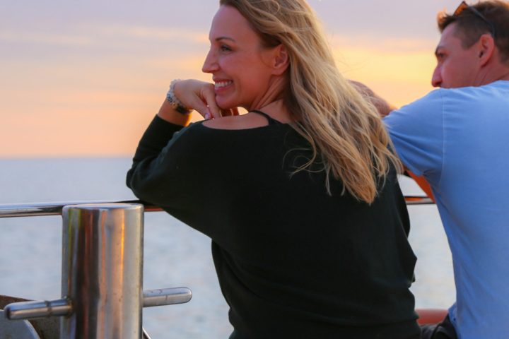 a woman eating a hot dog