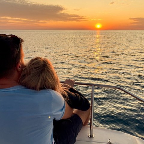 a person standing in front of a body of water
