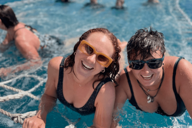 a group of people swimming in the water