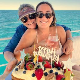 a woman sitting at a beach